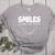 Smile Smiles Change The World Teacher T-Shirt Happy T-Shirt Women's Heather T-Shirt Athletic Heather