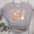 Trick Or Teach Pumpkin Candy Corn Ghost Halloween Teacher Women's Heather T-Shirt Athletic Heather