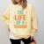 The Life Of A Teacher Comfort Colors Sweatshirt Butter The Life Of A Teacher Comfort Colors Sweatshirt Butter