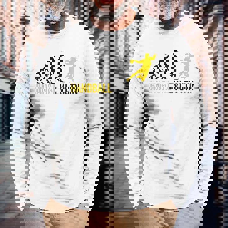ハンドボール選手の進化ハンドボール 長袖Tシャツ 高齢者への贈り物