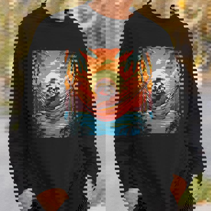 ナマケモノ ハンモック トロピカル サンセット リラクゼーション ヤシの木 平和 長袖tシャツ スウェットシャツ 彼への贈り物