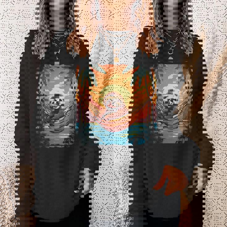 ナマケモノ ハンモック トロピカル サンセット リラクゼーション ヤシの木 平和 長袖tシャツ スウェットシャツ 彼女への贈り物