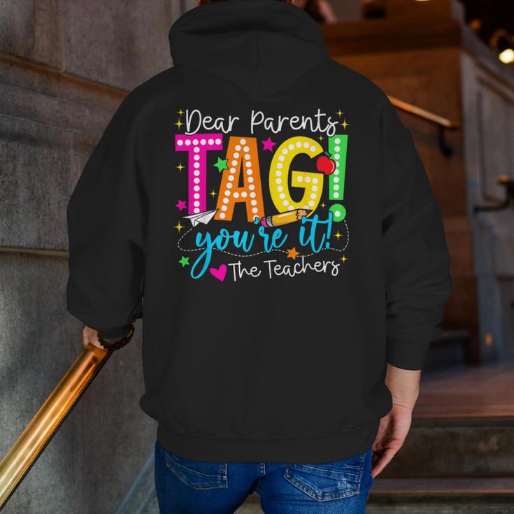 Dear Parents Tag You'Re It Love Teachers Last Day Of School Men Zip Up Hoodie Back Print, funny gift
