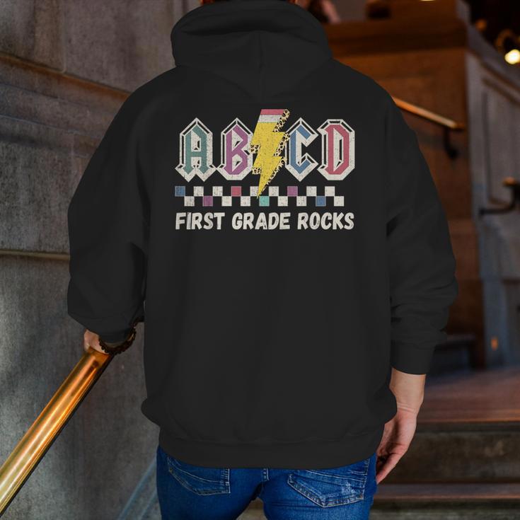 First Grade Rocks Teachers Back To School ABCD Rock Students Men Zip Up Hoodie Back Print, First Grade Teacher Hoodies, funny gift First Grade Rocks Teachers Back To School ABCD Rock Students Men Zip Up Hoodie Back Print, First Grade Teacher Hoodies, funny gift