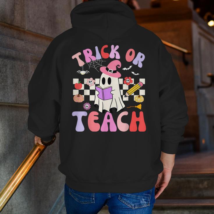 Trick Or Teach Halloween Teacher Floral Ghost Groovy Men Zip Up Hoodie Back Print, Groovy Teacher Hoodies, funny gift