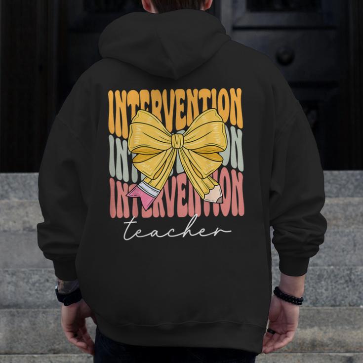 Interventionist Teacher Groovy Coquette Bow Back To School Men Zip Up Hoodie Back Print, Groovy Teacher Gifts, funny design