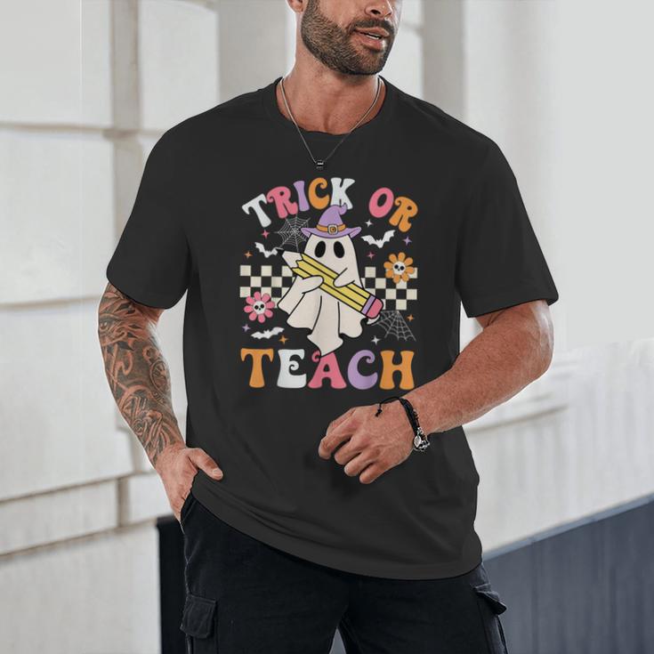 Trick Or Teach Groovy Teacher Halloween Retro Teacher Ghost Unisex T-Shirt, novelty gifts, funny gifts Trick Or Teach Groovy Teacher Halloween Retro Teacher Ghost Unisex T-Shirt, novelty gifts, funny gifts