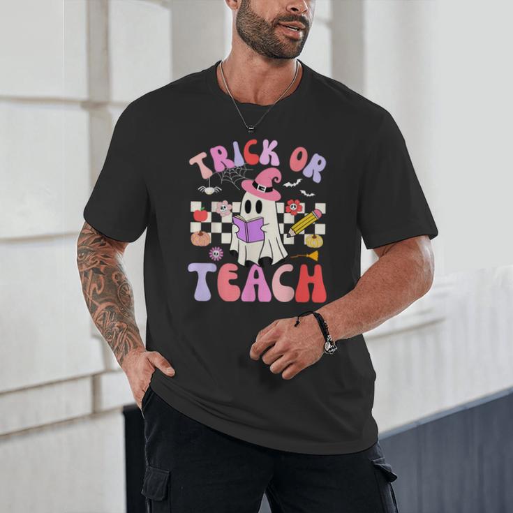 Trick Or Teach Halloween Teacher Floral Ghost Groovy Unisex T-Shirt, novelty gifts, funny gifts Trick Or Teach Halloween Teacher Floral Ghost Groovy Unisex T-Shirt, novelty gifts, funny gifts