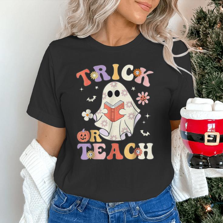 Groovy Halloween Trick Or Teach Retro Floral Ghost Teacher Unisex T-Shirt, Groovy Teacher Shirts, gift for family, gift for coworker Groovy Halloween Trick Or Teach Retro Floral Ghost Teacher Unisex T-Shirt, Groovy Teacher Shirts, gift for family, gift for coworker