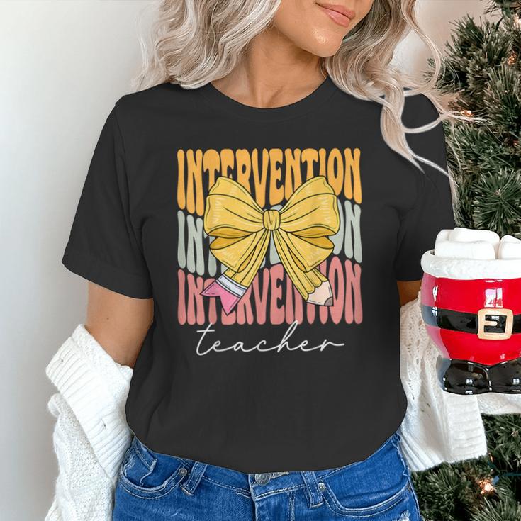 Interventionist Teacher Groovy Coquette Bow Back To School Unisex T-Shirt, Groovy Teacher Shirts, gift for family, gift for coworker