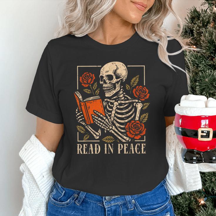 Read In Peace Skeleton Reading Book Halloween Teacher Unisex T-Shirt, gift for family, gift for coworker Read In Peace Skeleton Reading Book Halloween Teacher Unisex T-Shirt, gift for family, gift for coworker