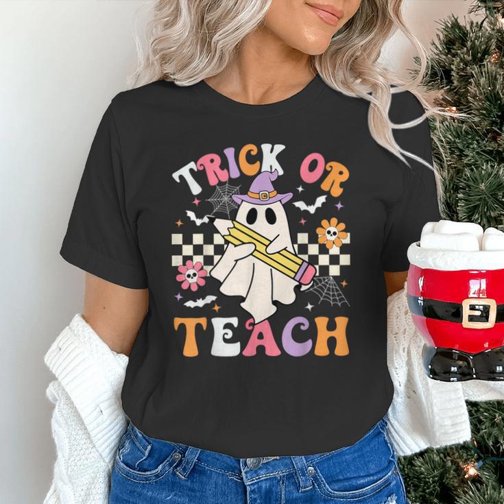Trick Or Teach Groovy Teacher Halloween Retro Teacher Ghost Unisex T-Shirt, Groovy Teacher Shirts, gift for family, gift for coworker Trick Or Teach Groovy Teacher Halloween Retro Teacher Ghost Unisex T-Shirt, Groovy Teacher Shirts, gift for family, gift for coworker