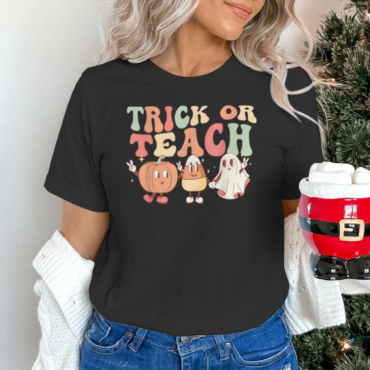 Trick Or Teach Pumpkin Candy Corn Ghost Halloween Teacher Unisex T-Shirt, gift for family, gift for coworker Trick Or Teach Pumpkin Candy Corn Ghost Halloween Teacher Unisex T-Shirt, gift for family, gift for coworker