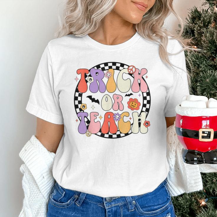 Trick Or Teach Retro Groovy Halloween Teacher Unisex T-Shirt, Groovy Teacher Shirts, gift for family, gift for coworker