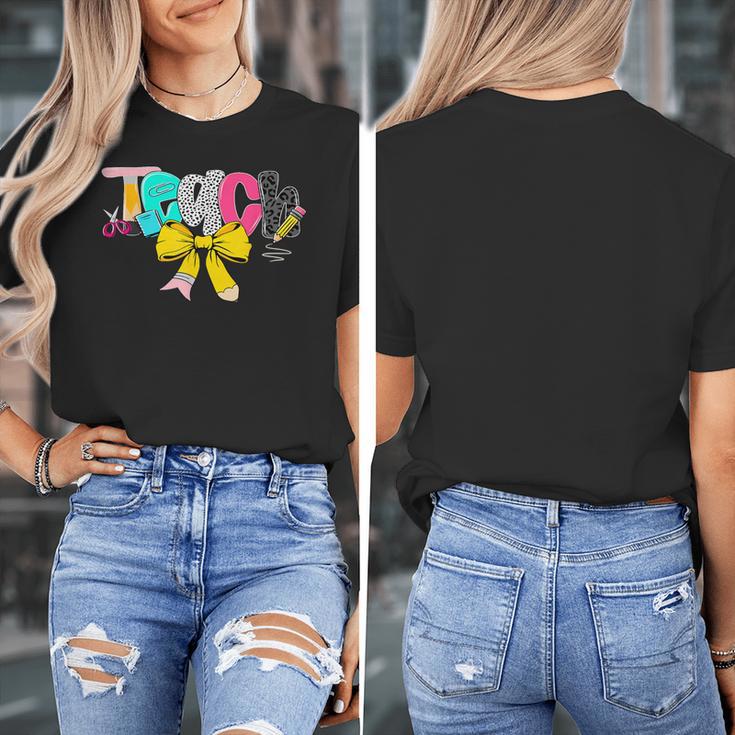 Teach Coquette Bow Teacher Back To School Happy First Day Women's T-Shirt, funny design