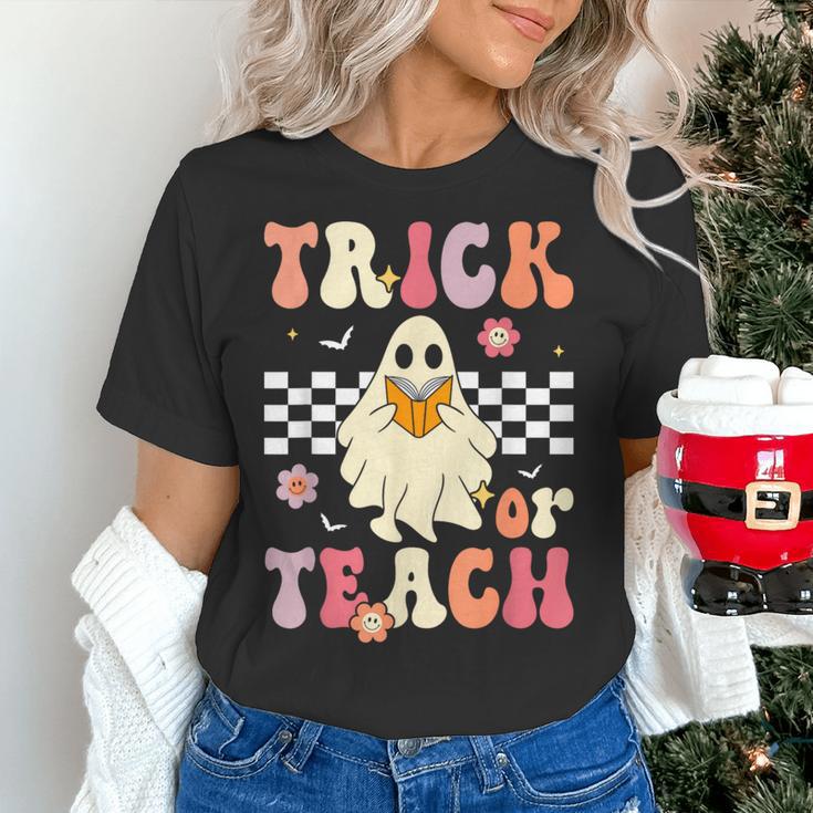 Groovy Teacher Halloween Retro Trick Or Teach Floral Ghost Women's T-Shirt, Groovy Teacher Shirts, gift for family, gift for coworker