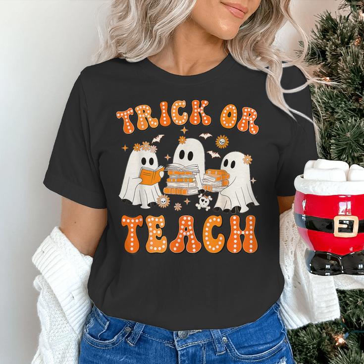 Teacher Halloween Trick Or Teach Retro Groovy Floral Ghost Women's T-Shirt, Groovy Teacher Shirts, gift for family, gift for coworker Teacher Halloween Trick Or Teach Retro Groovy Floral Ghost Women's T-Shirt, Groovy Teacher Shirts, gift for family, gift for coworker