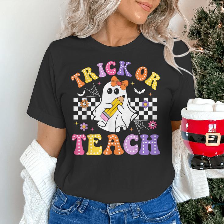 Trick Or Teach Groovy Halloween Teachers Women's T-Shirt, gift for family, gift for coworker Trick Or Teach Groovy Halloween Teachers Women's T-Shirt, gift for family, gift for coworker