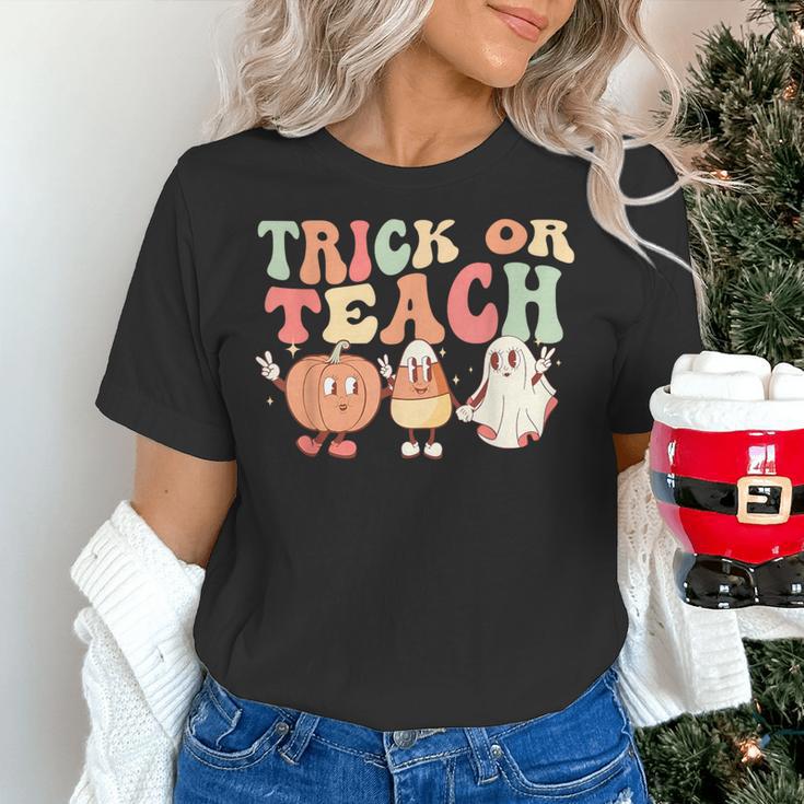 Trick Or Teach Pumpkin Candy Corn Ghost Halloween Teacher Women's T-Shirt, gift for family, gift for coworker Trick Or Teach Pumpkin Candy Corn Ghost Halloween Teacher Women's T-Shirt, gift for family, gift for coworker