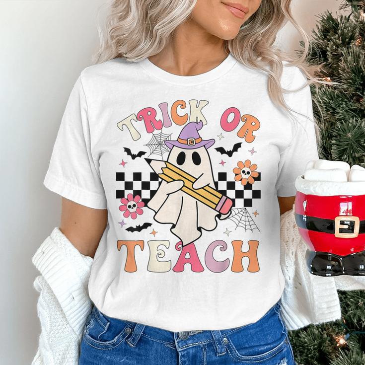 Trick Or Teach Groovy Teacher Halloween Retro Floral Ghost Women's T-Shirt, Groovy Teacher Shirts, gift for family, gift for coworker