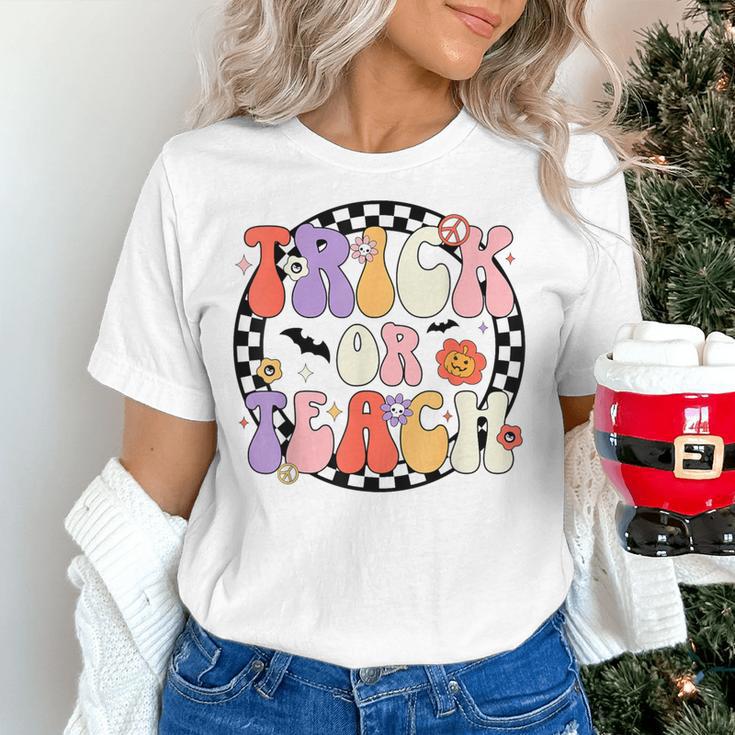 Trick Or Teach Retro Groovy Halloween Teacher Women's T-Shirt, Groovy Teacher Shirts, gift for family, gift for coworker