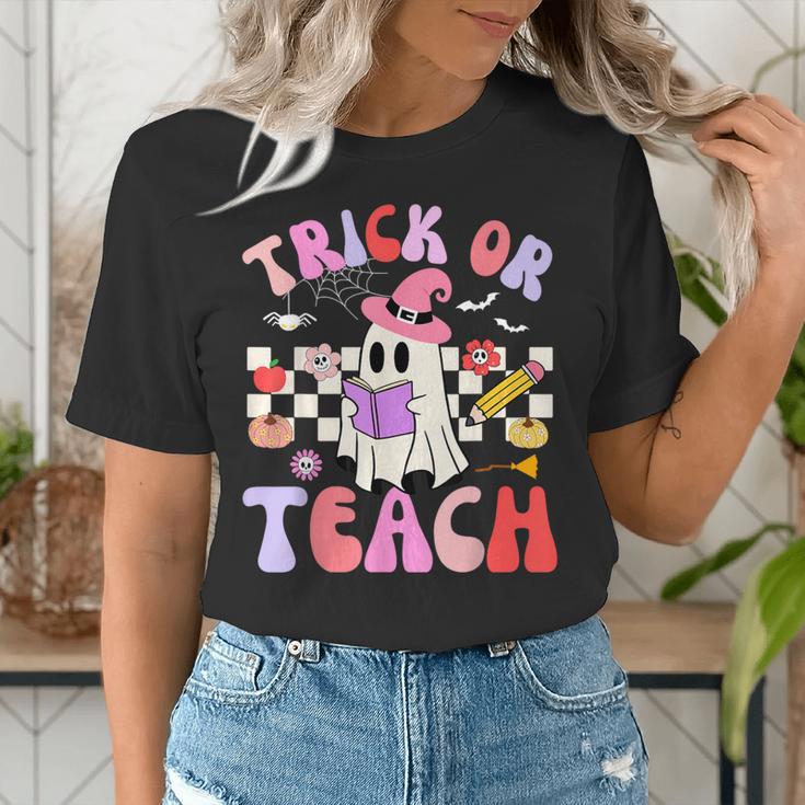 Trick Or Teach Halloween Teacher Floral Ghost Groovy Women's T-Shirt, Groovy Teacher Shirts, funny gift Trick Or Teach Halloween Teacher Floral Ghost Groovy Women's T-Shirt, Groovy Teacher Shirts, funny gift