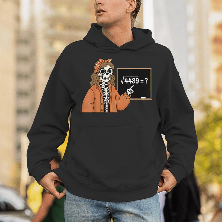 67 Math Teacher Skeleton Halloween Root 4489 Messy Bun Women Unisex Hoodie, funny gift