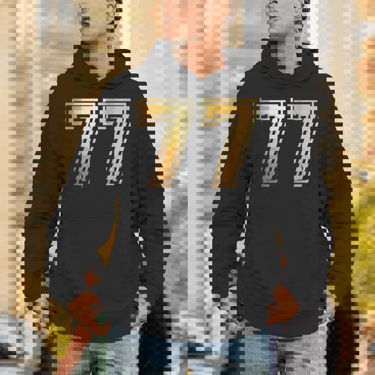 77 ナンバーセブンティセブンチーム スポーツ グラフィック 代表チームマッチング パーカー