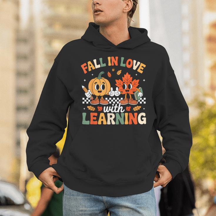 Fall In Love With Learning Shirt Autumn Thanksgiving Teacher Unisex Hoodie, funny gift