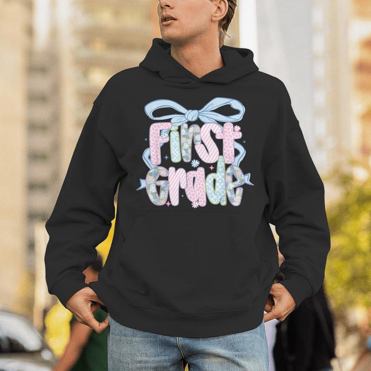 First Grade Coquette Bow Girls Teacher Team 1st Grade Squad Unisex Hoodie, First Grade Teacher Hoodies, funny gift First Grade Coquette Bow Girls Teacher Team 1st Grade Squad Unisex Hoodie, First Grade Teacher Hoodies, funny gift
