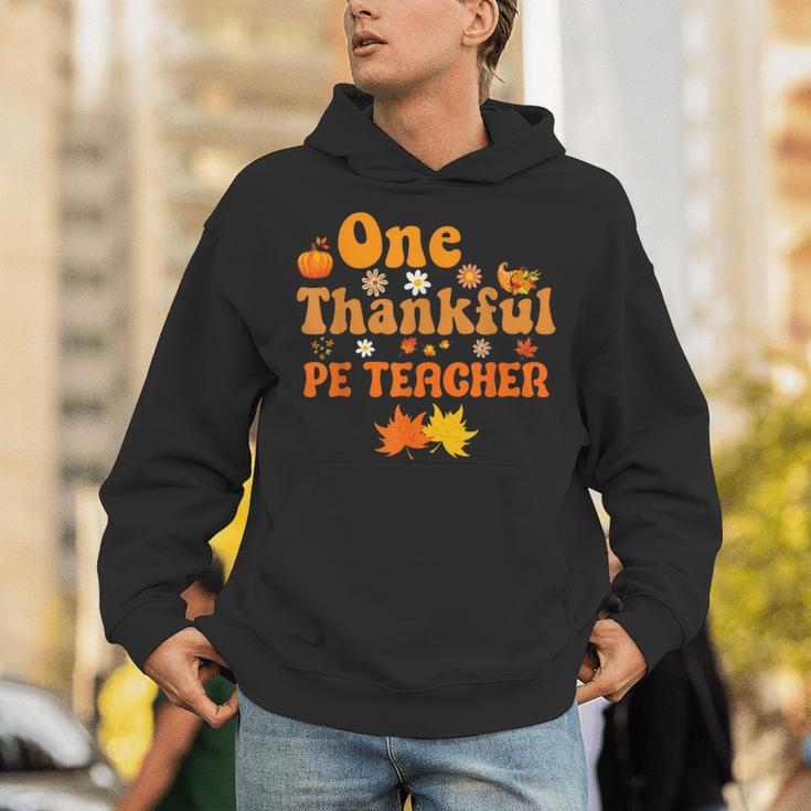 One Thankful PE Teacher Thanksgiving Fall Autumn Groovy Unisex Hoodie, Pe Teacher Hoodies, Groovy Teacher Hoodies, funny gift