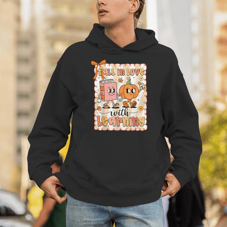 Pumpkin Teacher Preppy Fall In Love With Learning Autumn Unisex Hoodie, funny gift Pumpkin Teacher Preppy Fall In Love With Learning Autumn Unisex Hoodie, funny gift