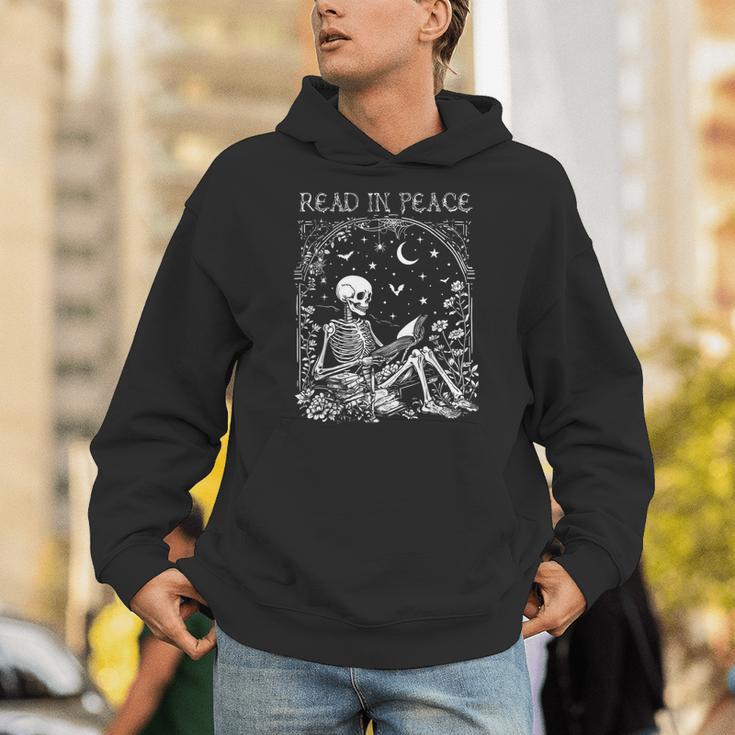 Read In Peace Skeleton Reading Teacher Spooky Halloween Unisex Hoodie, funny gift Read In Peace Skeleton Reading Teacher Spooky Halloween Unisex Hoodie, funny gift