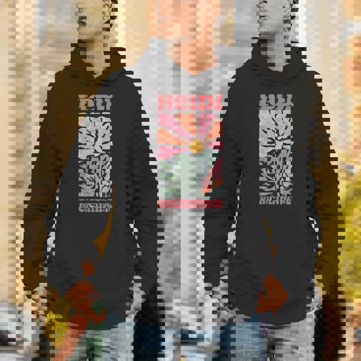 Tax The Rich ファン記事 左 Merch ハイジ・ライチネク パーカー