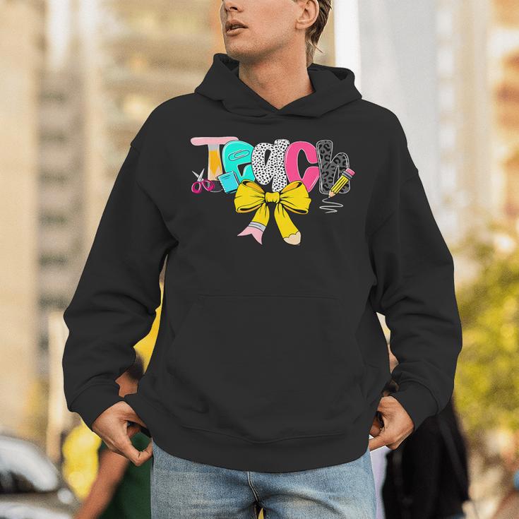 Teach Coquette Bow Teacher Back To School Happy First Day Unisex Hoodie, funny gift
