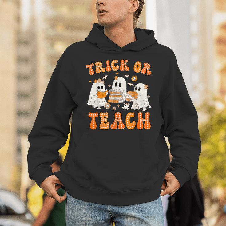 Teacher Halloween Trick Or Teach Retro Groovy Floral Ghost Unisex Hoodie, Groovy Teacher Hoodies, funny gift Teacher Halloween Trick Or Teach Retro Groovy Floral Ghost Unisex Hoodie, Groovy Teacher Hoodies, funny gift