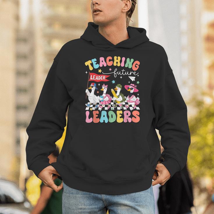 Teaching Future Leaders Groovy Teacher Back To School Unisex Hoodie, Future Teacher Hoodies, Groovy Teacher Hoodies, funny gift Teaching Future Leaders Groovy Teacher Back To School Unisex Hoodie, Future Teacher Hoodies, Groovy Teacher Hoodies, funny gift