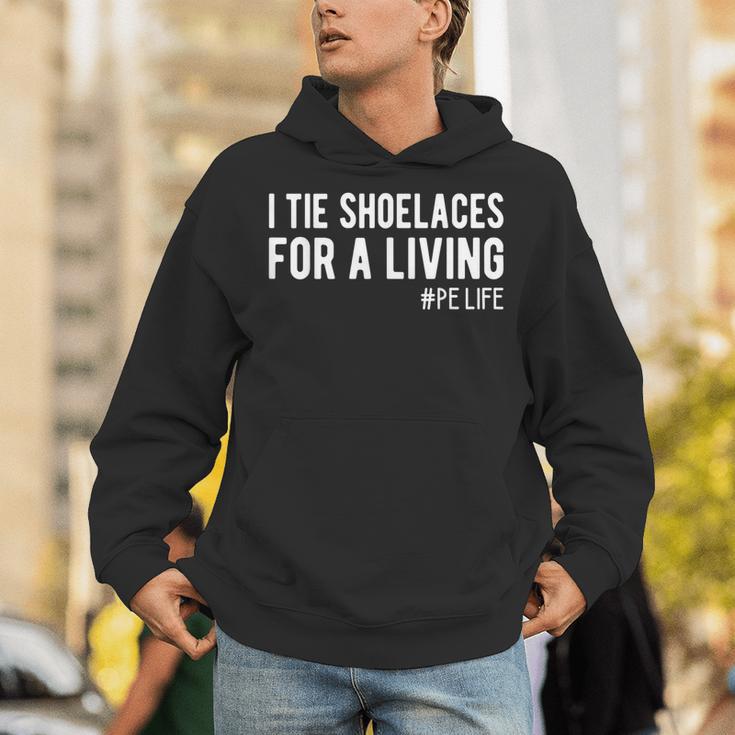 I Tie Shoelaces For a Living Elementary PE Teacher Unisex Hoodie, Pe Teacher Hoodies, funny gift I Tie Shoelaces For a Living Elementary PE Teacher Unisex Hoodie, Pe Teacher Hoodies, funny gift