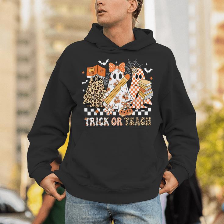 Trick Or Teach Groovy Teacher Halloween Floral Ghost Unisex Hoodie, Groovy Teacher Hoodies, funny gift