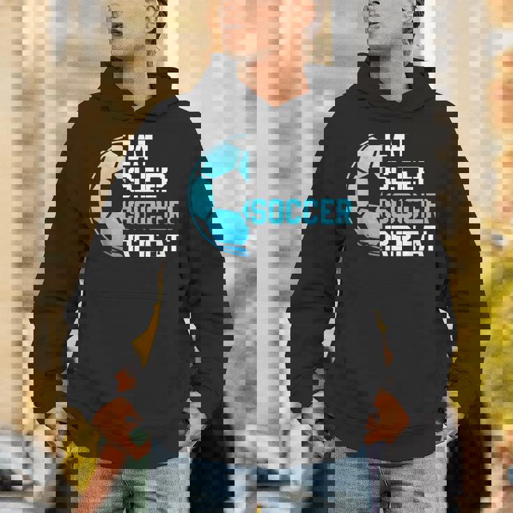 食べる、寝る、サッカーを繰り返す、面白いスポーツ、サッカー愛好家 パーカー