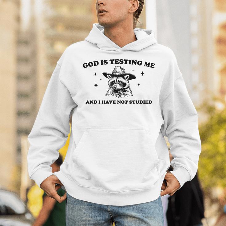 God Is Testing Me And I Have Not Studied Funny Raccon T-Shirt Unisex Hoodie God Is Testing Me And I Have Not Studied Funny Raccon T-Shirt Unisex Hoodie