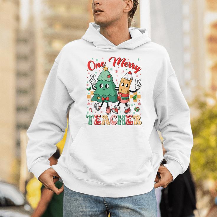 One Merry Teacher Groovy Christmas Tree Pjs Xmas Teacher Unisex Hoodie, Groovy Teacher Hoodies, funny gift One Merry Teacher Groovy Christmas Tree Pjs Xmas Teacher Unisex Hoodie, Groovy Teacher Hoodies, funny gift
