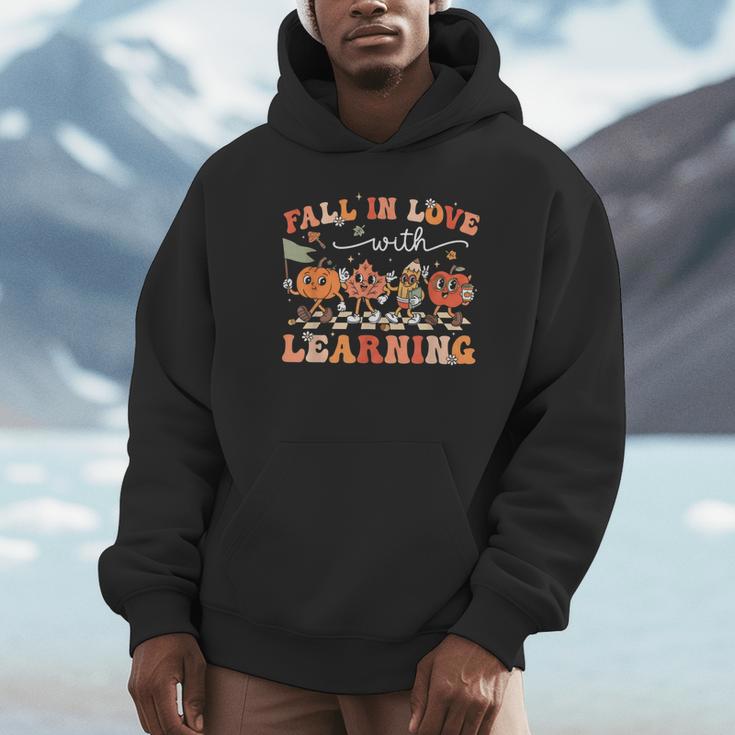 Fall In Love With Learning Autumn Teacher Thanksgiving Unisex Hoodie, novelty gifts, funny gifts