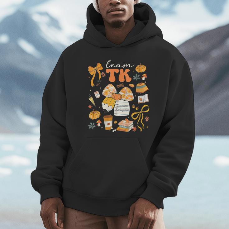 Team TK Crew Preppy Coquette Bow Pumpkin Fall TK Teacher Unisex Hoodie, novelty gifts, funny gifts Team TK Crew Preppy Coquette Bow Pumpkin Fall TK Teacher Unisex Hoodie, novelty gifts, funny gifts