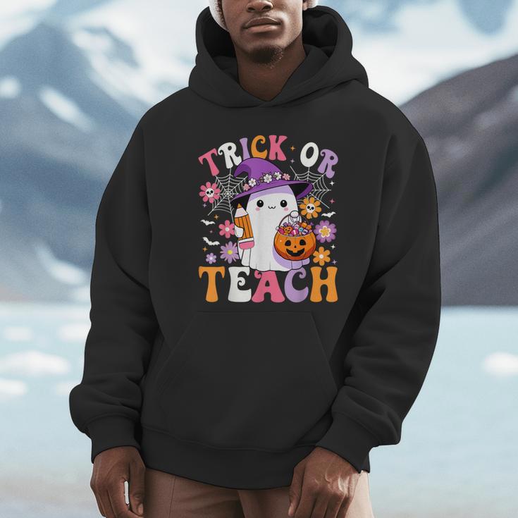Trick Or Teach Groovy Teacher Ghost Halloween Teacher Unisex Hoodie, novelty gifts, funny gifts