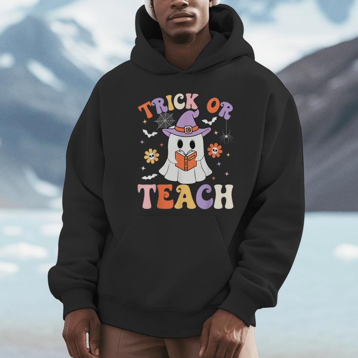 Trick Or Teach Teacher Groovy Ghost Halloween Teacher Unisex Hoodie, novelty gifts, funny gifts Trick Or Teach Teacher Groovy Ghost Halloween Teacher Unisex Hoodie, novelty gifts, funny gifts