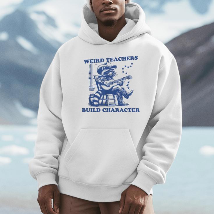 Weird Teachers Build Character Shirt Raccoon Teacher Unisex Hoodie, novelty gifts, funny gifts