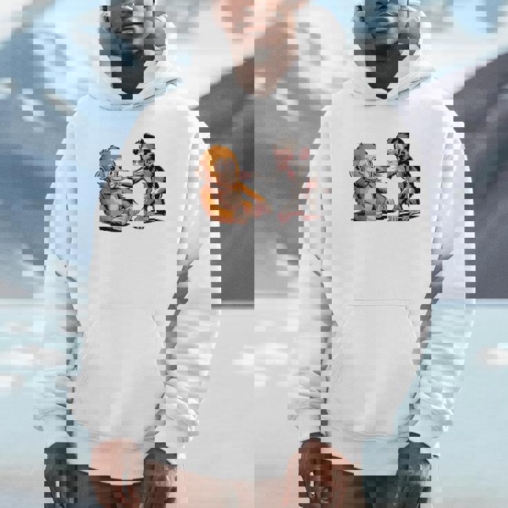 オレンジのおもちゃで悲しい猿のパンチ パーカー