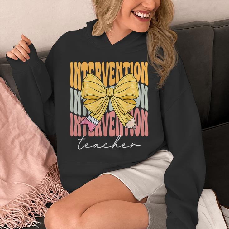 Interventionist Teacher Groovy Coquette Bow Back To School Unisex Hoodie, Groovy Teacher Gifts, funny design Interventionist Teacher Groovy Coquette Bow Back To School Unisex Hoodie, Groovy Teacher Gifts, funny design
