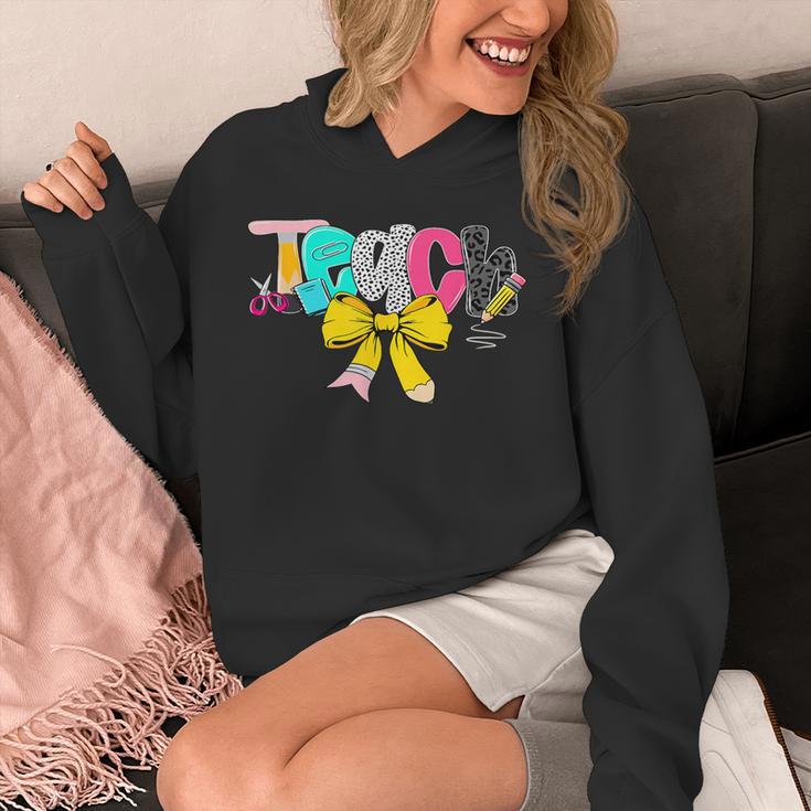 Teach Coquette Bow Teacher Back To School Happy First Day Unisex Hoodie, funny design